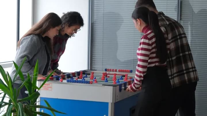 Webtures team playing foosball